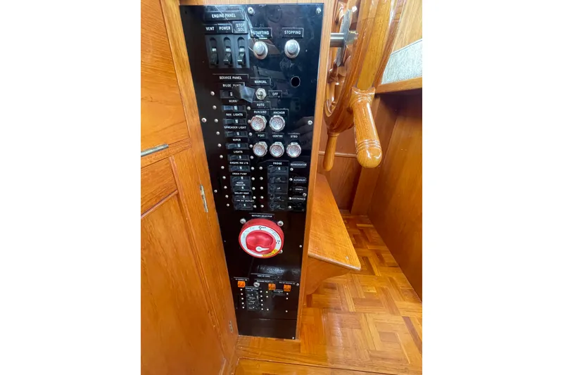 Slide: The Image of Control panel of a 1982 Grand Banks 32 Sedan boat, featuring switches and gauges. - 10