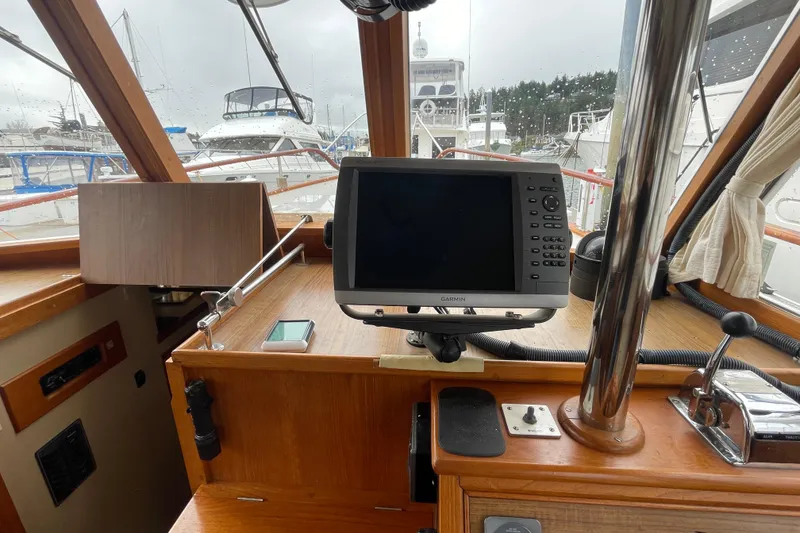 Slide: The Image of Interior helm of 1982 Grand Banks 32 Sedan with navigation equipment. - 13