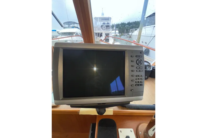 Slide: The Image of Garmin navigation system on 1982 Grand Banks 32 Sedan boat dashboard. - 14