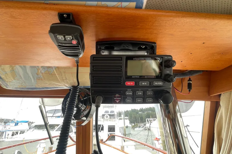 Slide: The Image of VHF radio equipment inside a 1982 Grand Banks 32 Sedan boat cabin. - 17