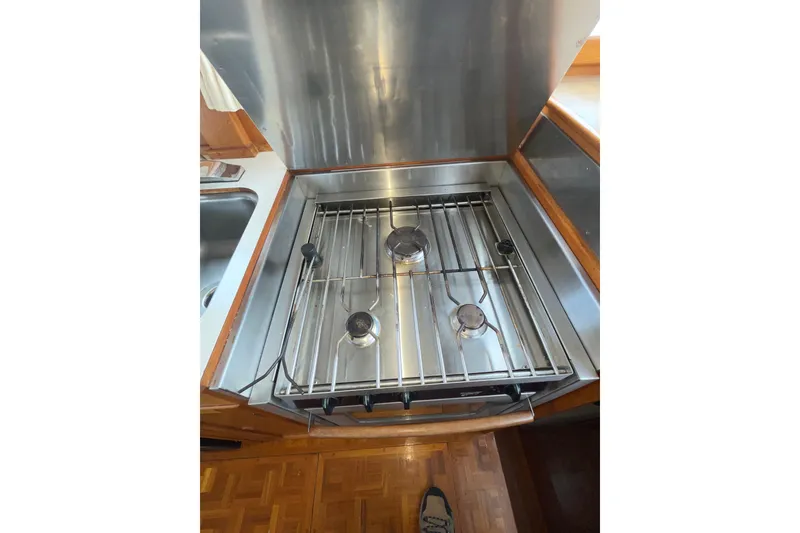 Slide: The Image of Stainless steel stove in 1982 Grand Banks 32 Sedan yacht kitchen. - 19