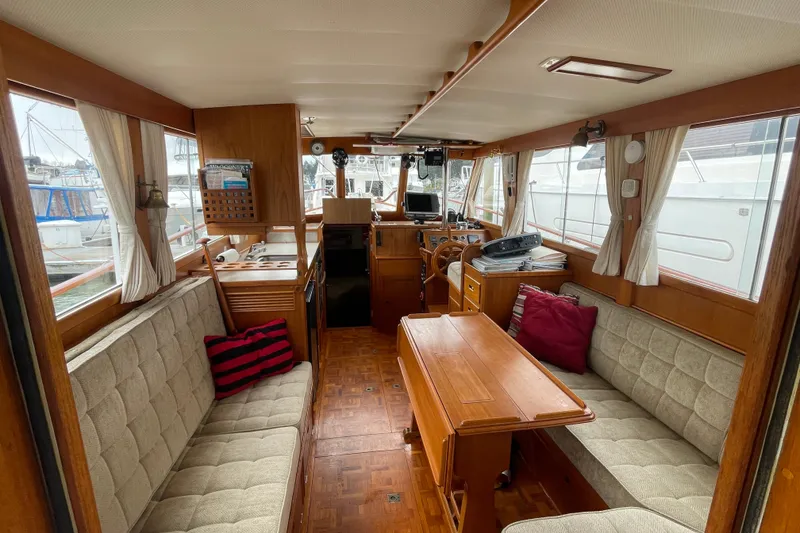 Slide: The Image of Interior of a 1982 Grand Banks 32 Sedan with wood furnishings and seating. - 2