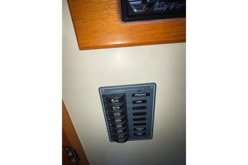 Slide: The Image of Electrical panel on a 1982 Grand Banks 32 Sedan boat interior. - 21