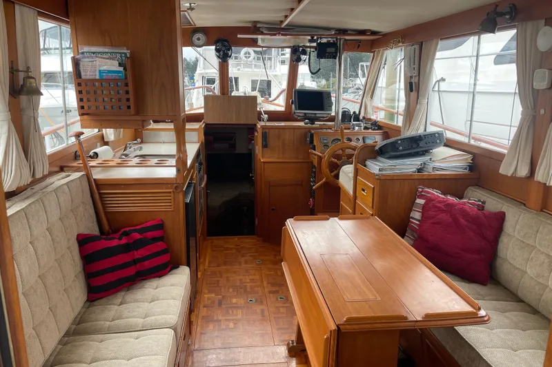 Slide: The Image of Interior of 1982 Grand Banks 32 Sedan with wood furnishings and nautical decor. - 3
