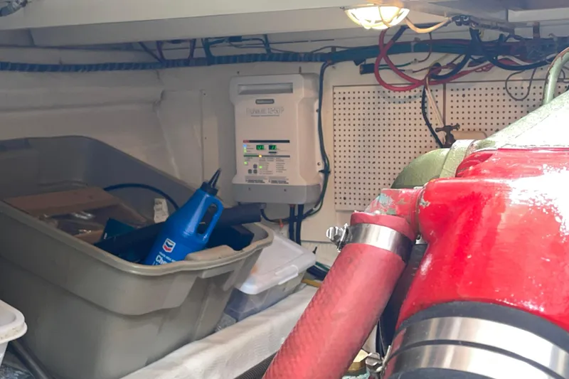 Slide: The Image of Engine room of 1982 Grand Banks 32 Sedan with equipment and storage bin. - 31