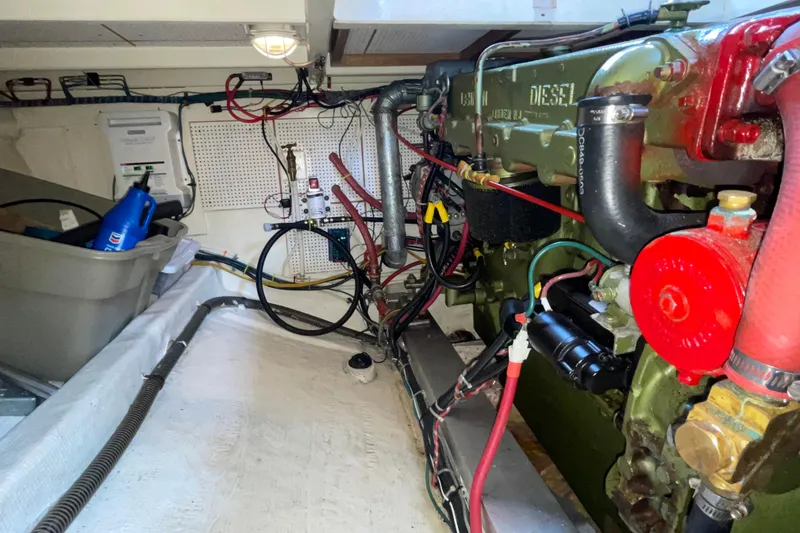 Slide: The Image of Engine room of a 1982 Grand Banks 32 Sedan with visible diesel engine components. - 33