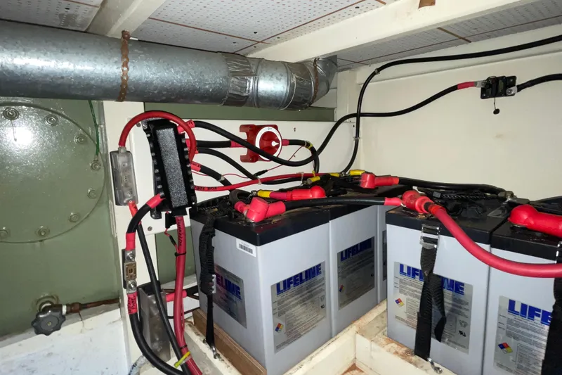 Slide: The Image of Battery compartment of a 1982 Grand Banks 32 Sedan with Lifeline batteries and wiring. - 35