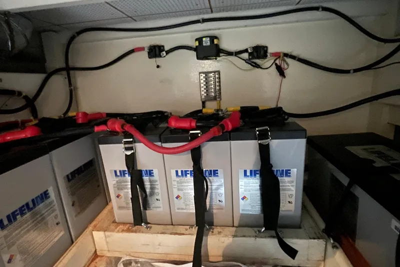 Slide: The Image of Battery compartment of a 1982 Grand Banks 32 Sedan with Lifeline batteries and wiring. - 36
