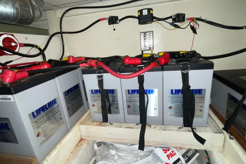 Slide: The Image of Battery setup in a 1982 Grand Banks 32 Sedan boat engine room. - 37