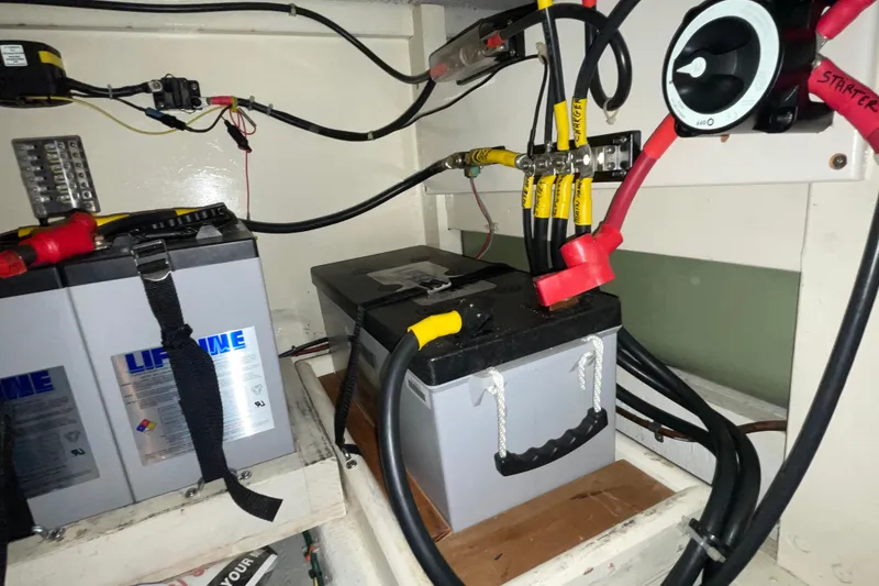 Slide: The Image of Battery compartment of a 1982 Grand Banks 32 Sedan with Lifeline batteries and wiring. - 38