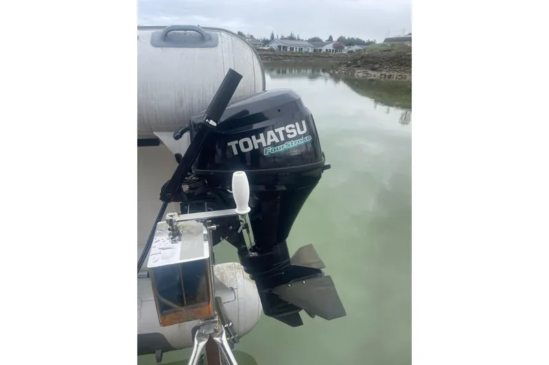 Slide: The Image of Tohatsu FourStroke outboard motor on a 1982 Grand Banks 32 Sedan boat. - 41