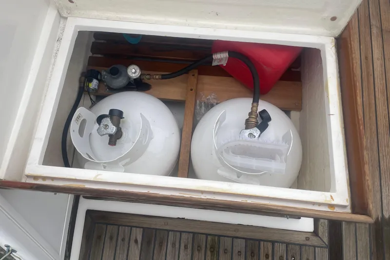 Slide: The Image of Storage compartment with propane tanks on a 1982 Grand Banks 32 Sedan boat. - 45