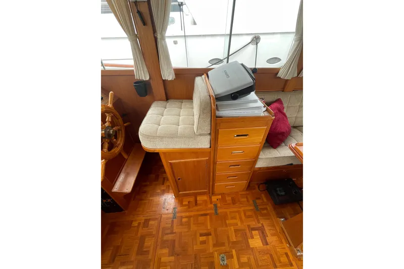 Slide: The Image of Interior of 1982 Grand Banks 32 Sedan with wooden cabinetry and cushioned seating. - 5