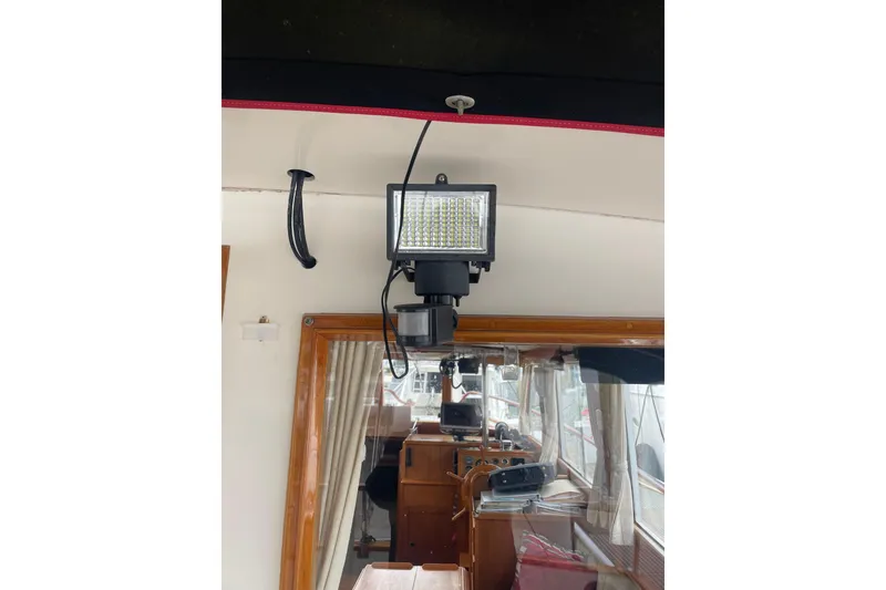 Slide: The Image of LED light fixture inside 1982 Grand Banks 32 Sedan boat cabin. - 54