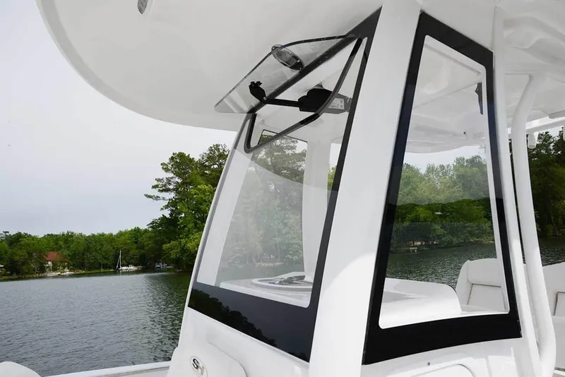 Slide: The Image of 2018 Sea Hunt Ultra 255 SE cruising on open water, leaving a wake trail. - 2