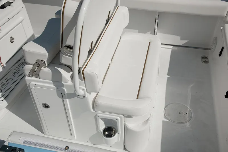 Slide: The Image of 2018 Sea Hunt Ultra 255 SE cruising on clear blue water. - 4