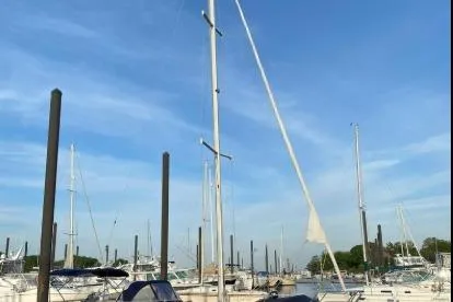 Slide: The Image of 1997 Catalina 28 MkII sailboats docked under a clear blue sky. - 2