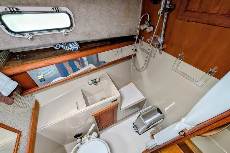 Slide: The Image of Bathroom interior of 1986 Bayliner 3270 Motoryacht with shower and sink. - 24