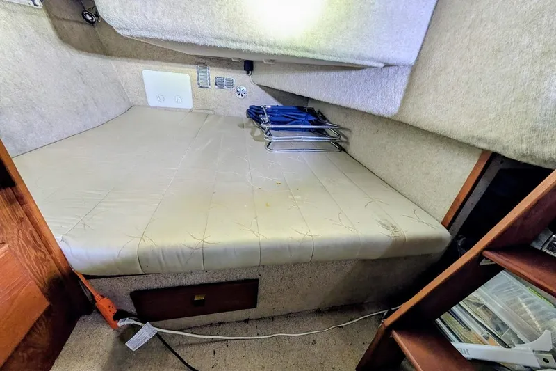 Slide: The Image of Interior cabin of 1986 Bayliner 3270 Motoryacht with bed and storage shelves. - 27