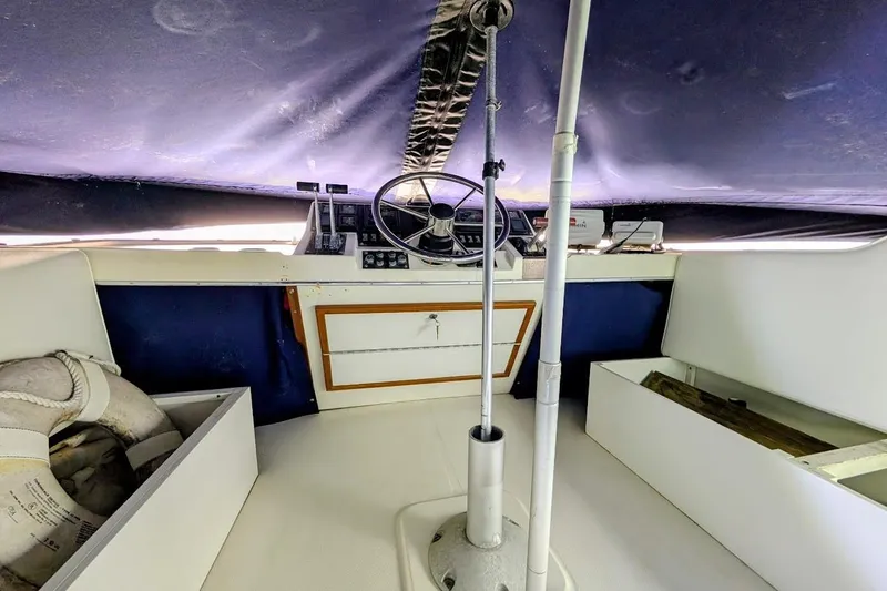 Slide: The Image of Interior helm of 1986 Bayliner 3270 Motoryacht with steering wheel and navigation equipment. - 28