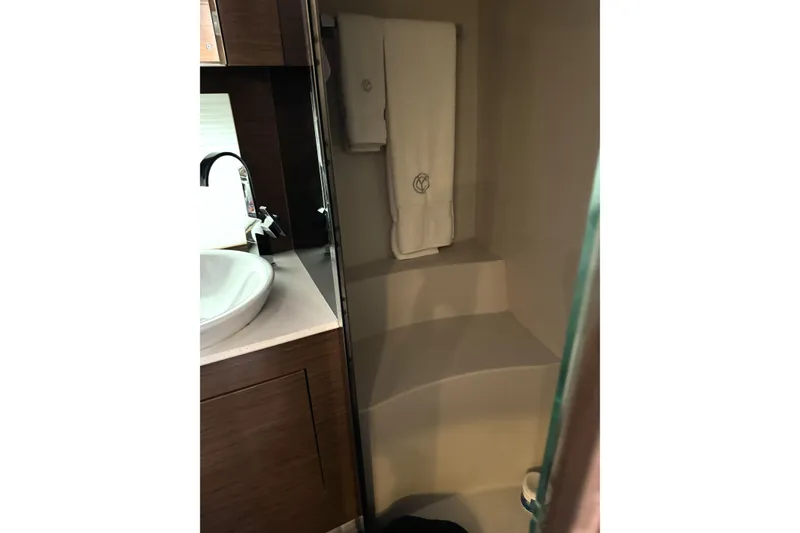 Slide: The Image of 2017 Cruisers Yachts 390 Express Coupe bathroom with sink and towel. - 24