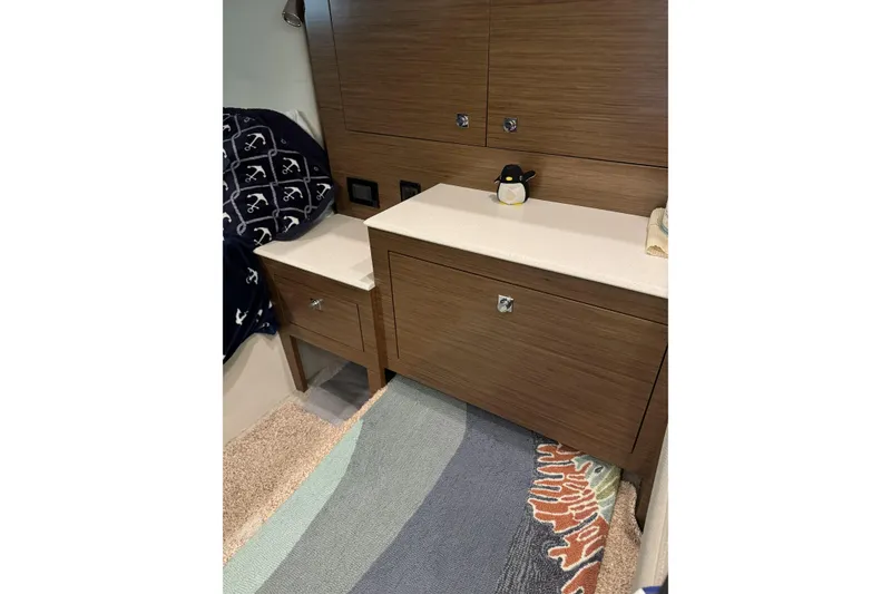 Slide: The Image of Interior of 2017 Cruisers Yachts 390 Express Coupe with wooden cabinetry and decorative accents. - 27
