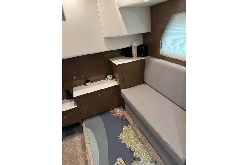 Slide: The Image of 2017 Cruisers Yachts 390 Express Coupe interior with modern seating and cabinetry. - 28