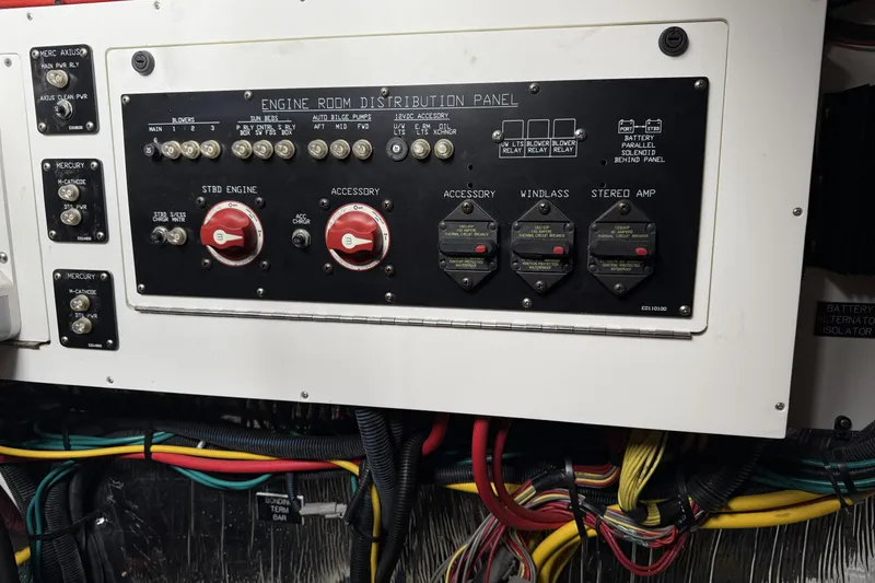 Slide: The Image of Engine room distribution panel of 2017 Cruisers Yachts 390 Express Coupe with wiring. - 29
