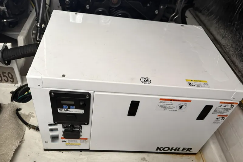 Slide: The Image of Kohler generator in 2017 Cruisers Yachts 390 Express Coupe engine room. - 32