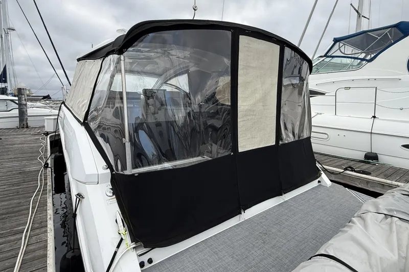 Slide: The Image of 2017 Cruisers Yachts 390 Express Coupe docked with covered cockpit. - 4