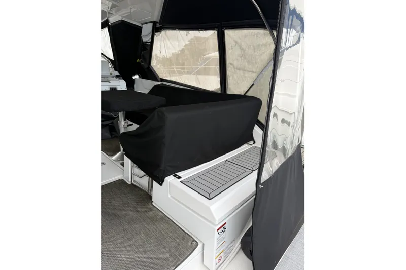 Slide: The Image of 2017 Cruisers Yachts 390 Express Coupe interior with covered seating and sleek design. - 7