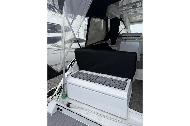 Slide: The Image of 2017 Cruisers Yachts 390 Express Coupe interior with covered seating and sleek design. - 8