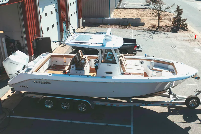 Slide: The Image of 2024 Everglades 315 Center Console boat parked on trailer. - 11