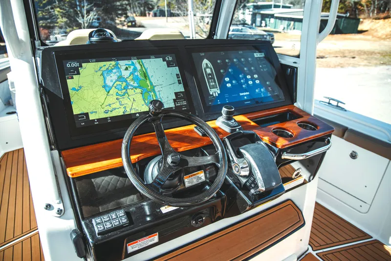 Slide: The Image of 2024 Everglades 315 Center Console helm with modern displays. - 12