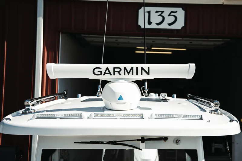 Slide: The Image of 2024 Everglades 315 Center Console with Garmin radar, docked at building 135. - 17