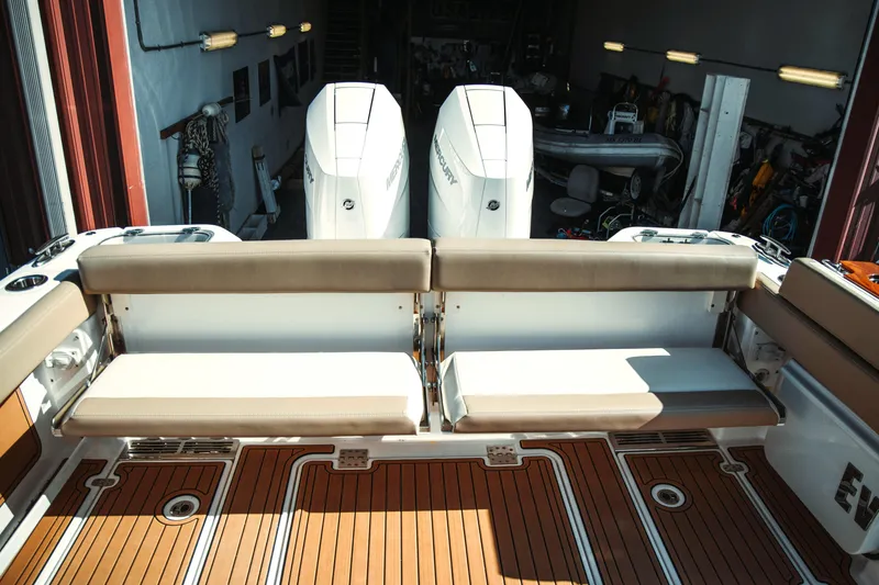 Slide: The Image of 2024 Everglades 315 Center Console with dual engines and seating bench. - 19