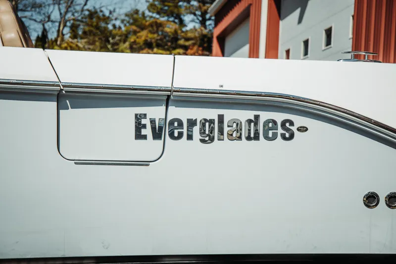 Slide: The Image of 2024 Everglades 315 Center Console boat side view with logo. - 21