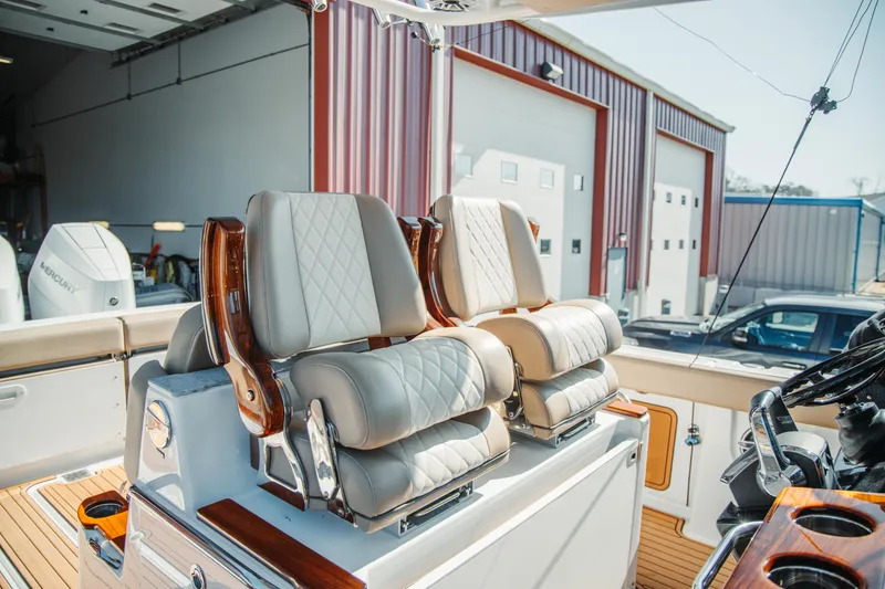 Slide: The Image of 2024 Everglades 315 Center Console boat with luxurious seating and modern design. - 25