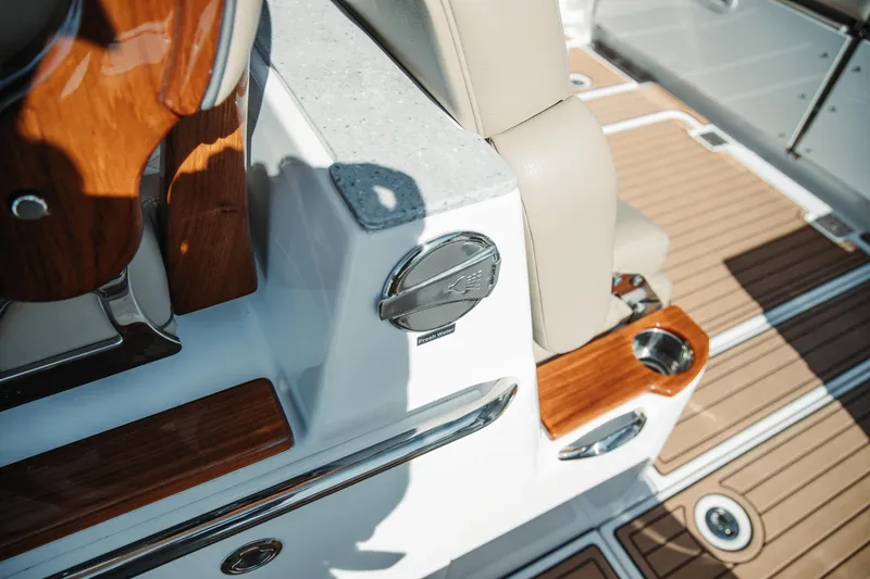 Slide: The Image of 2024 Everglades 315 Center Console interior with wood accents and seating detail. - 28