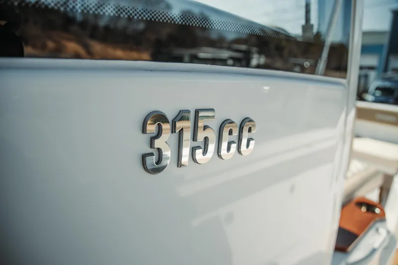 Slide: The Image of 2024 Everglades 315 Center Console boat emblem close-up. - 3