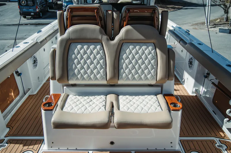 Slide: The Image of 2024 Everglades 315 Center Console boat with luxurious seating and teak flooring. - 34