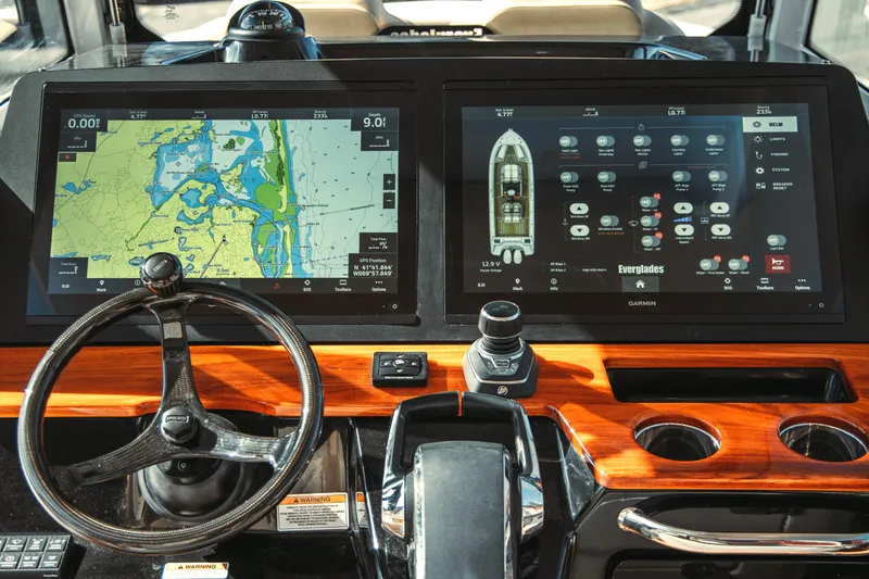 Slide: The Image of 2024 Everglades 315 Center Console with advanced navigation systems. - 38