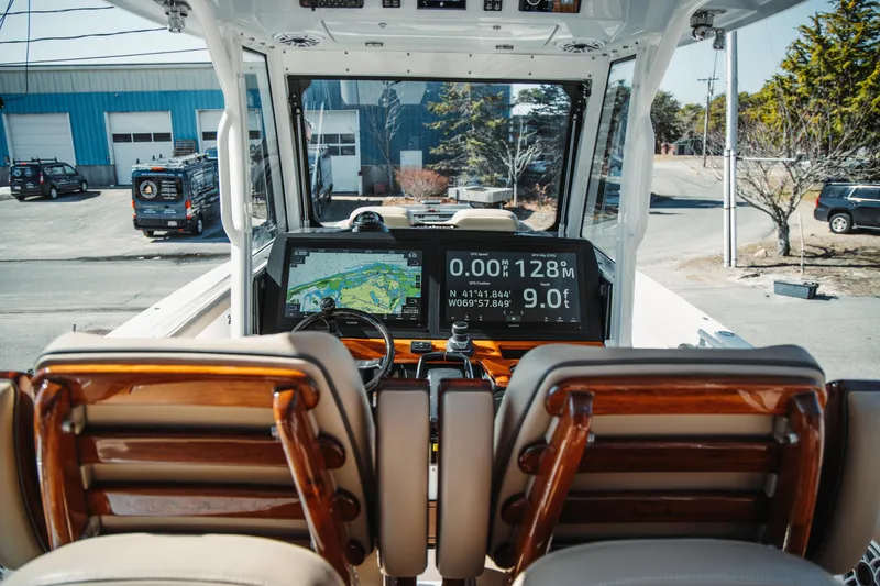 Slide: The Image of 2024 Everglades 315 Center Console boat interior with advanced navigation system. - 41