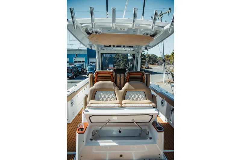 Slide: The Image of 2024 Everglades 315 Center Console boat interior with luxurious seating and modern design. - 47