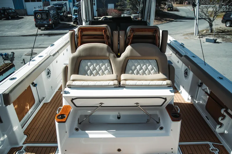 Slide: The Image of 2024 Everglades 315 Center Console boat interior with luxurious seating and teak flooring. - 48