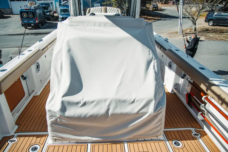 Slide: The Image of 2024 Everglades 315 Center Console boat with covered helm station on deck. - 55