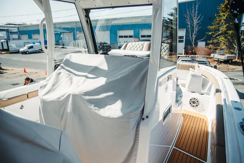 Slide: The Image of 2024 Everglades 315 Center Console boat interior with covered console and teak flooring. - 67