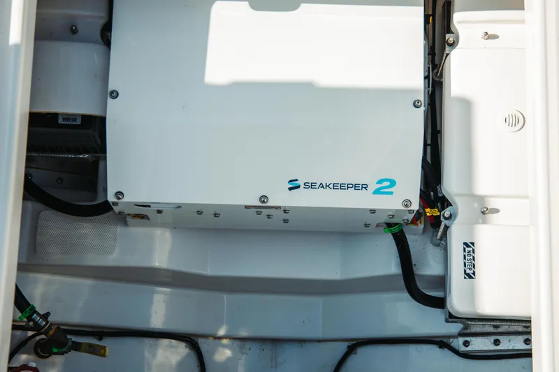 Slide: The Image of Seakeeper 2 stabilizer in 2024 Everglades 315 Center Console boat interior. - 76