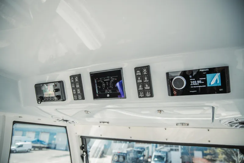 Slide: The Image of 2024 Everglades 315 Center Console dashboard with modern navigation and control systems. - 80