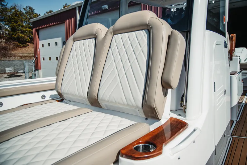 Slide: The Image of 2024 Everglades 315 Center Console boat with luxurious seating and elegant design. - 86